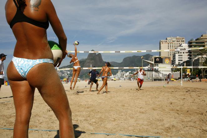 Women playing volleyball on Ipanema beach, Rio de Janeiro