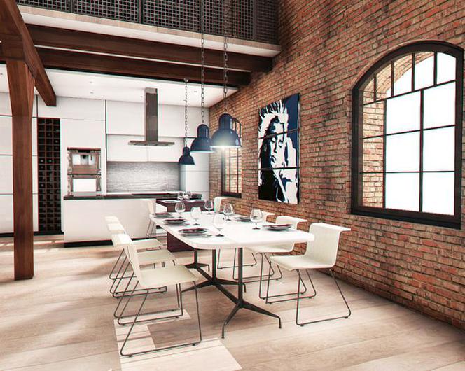 Stół wyznacza miejsce jadalni w otwartej przestrzeni w stylu industrialnym