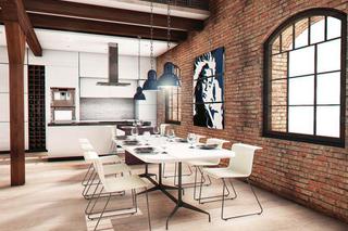 Stół wyznacza miejsce jadalni w otwartej przestrzeni w stylu industrialnym