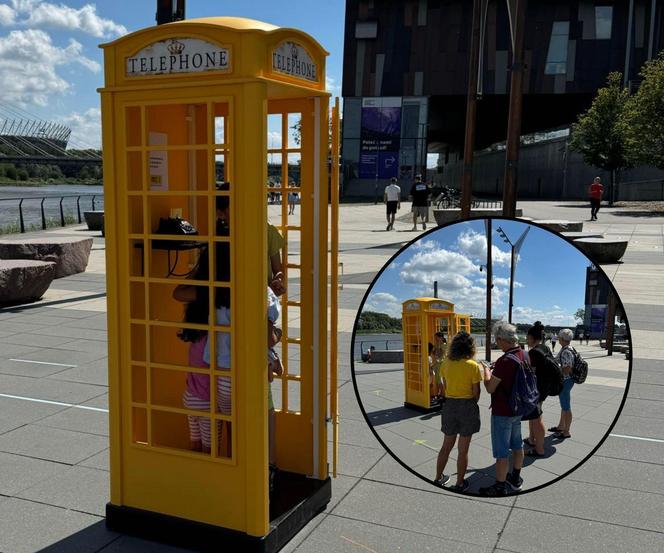 Żółta budka telefoniczna nad Wisłą