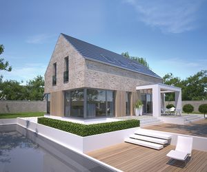 Bardzo ciepły dom: projekt ze skośnym dachem i dużymi oknami 