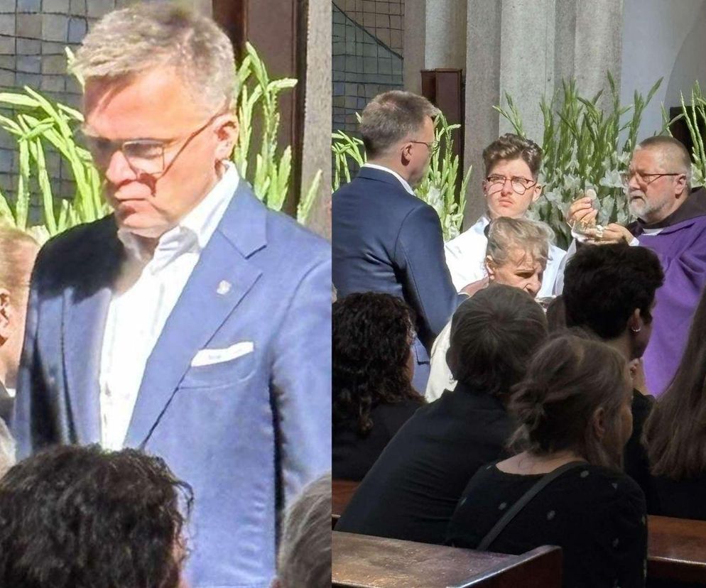 Szymon Hołownia przyjmuję komunię na pogrzebie Stanisława Sojki