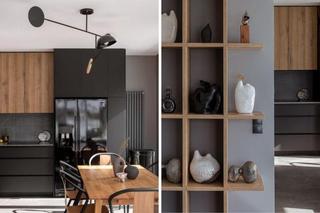 Loftowe, minimalistyczne mieszkanie z czarną kuchnią. Drewno nadało jej ciepła!