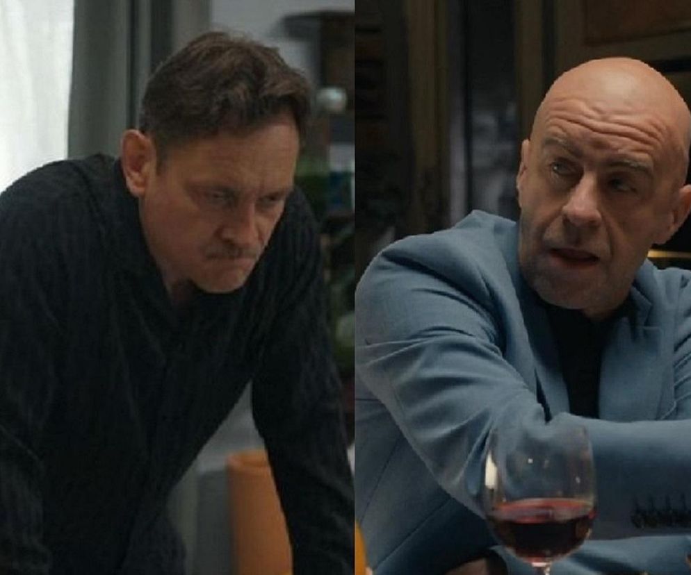 Aktorzy Paweł Ławrynowicz jako Robert Stefaniak i Andrzej Szeremeta jako gangster Bazylow na zbliżeniach w serialu Barwy szczęścia. Stefaniak ma zmartwioną minę, a Bazylow pije wino. Więcej o ich losach w Barwach szczęścia przeczytasz na stronie Super Seriale.