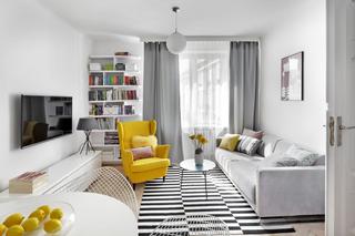 Żółty fotel w nowoczesnym salonie