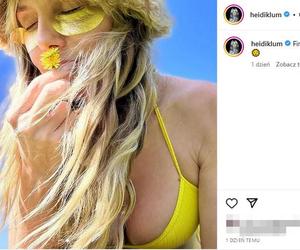 Heidi Klum półnago wygina się na trawie. Ma futrzaną czapę i kuse bikini. Co się dzieje z jej biustem?!