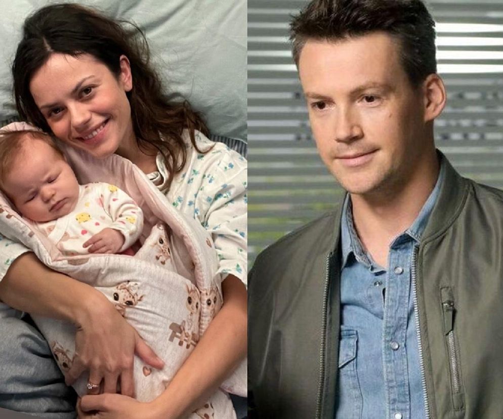 Paulina Lasota (Kasia) uśmiecha się, trzymając w ramionach śpiącą córeczkę, ubraną w białe body z żółtymi kaczuszkami i owiniętą w biały kocyk w żyrafy. Obok Krzysztof Kwiatkowski (Jakub Karski) w oliwkowej kurtce i dżinsowej koszuli, patrzący w bok. Więcej o ich losach na Super Seriale.