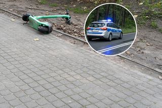 Nieprzytomny chłopiec na drodze, obok hulajnoga