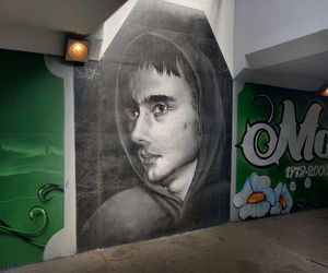 Mural z wizerunkiem Magika w przejściu podziemnym pod al. W. Roździeńskiego w Katowicach