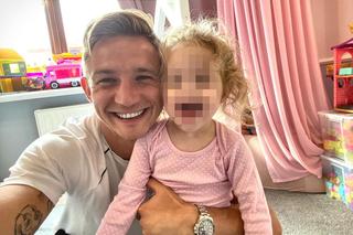 Jakub Rzezniczak z córką 