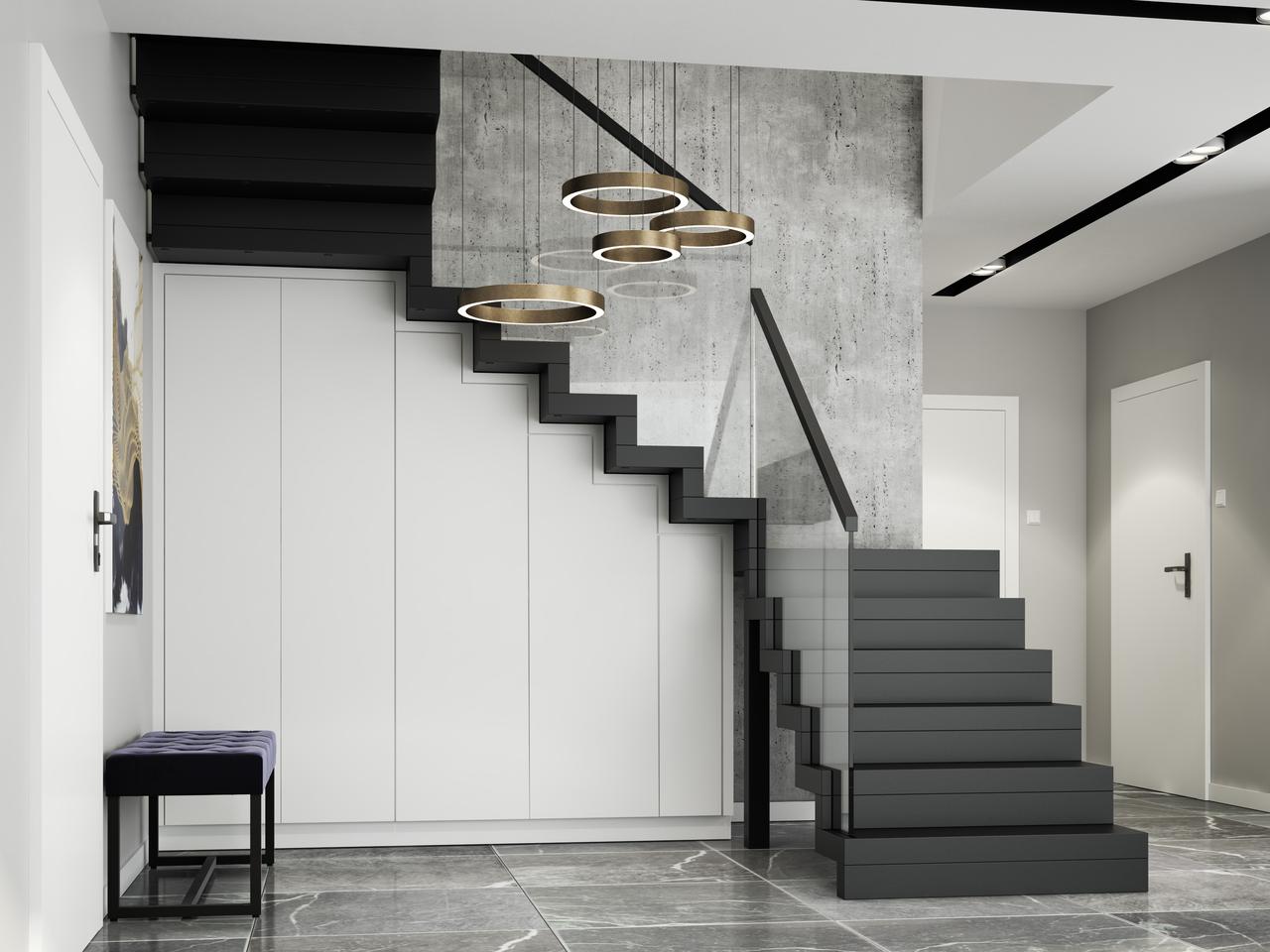 Zabudowa pod schodami. Sprytne pomysły na dodatkową przestrzeń w domu