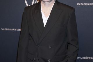 Syn Bartłomieja Topy z ojcem na ściance