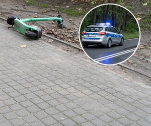 Nieprzytomny chłopiec na drodze, obok hulajnoga