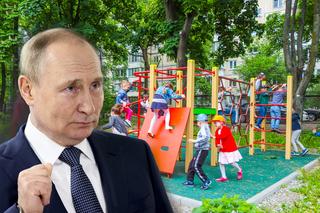 Zakrwawiony Putin atrakcją placu zabaw dla dzieci. Siedzi na maleńkim czołgu