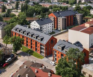 Życie w Architekturze 2025. Zespół budynków mieszkalnych wielorodzinnych z garażami podziemnymi oraz zagospodarowaniem terenu, urządzeniami budowlanymi i infrastrukturą techniczną. Mgr inż. arch. Wojciech Kołodyński