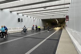 Rowerzyści i biegacze w tunelu