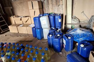 Rozlewnia bimbru rozbita. Tyciące litrów alkoholu przejęła Podlaska KAS