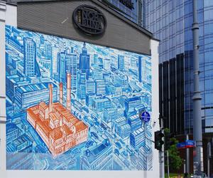 Warszawa, ulica Zelazna. Mural antysmogowy Zaklady Norblina stanowi odwzorowanie obrazu Edwarda Dwurnika Zaklady Norblina z 2009 roku