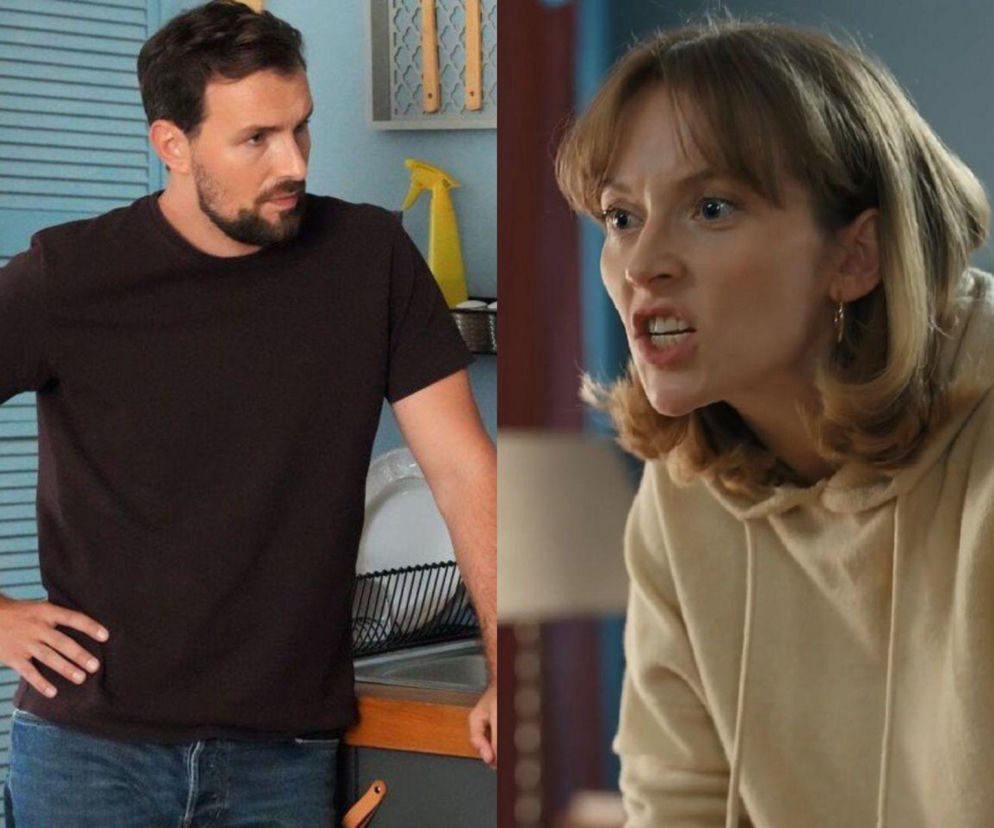 Marcin (Oskar Stoczyński) z brodą i w ciemnej koszulce stoi z ręką na biodrze w kuchni, patrząc w prawo. Obok Renata (Anna Mrozowska) w beżowej bluzie z kapturem, z otwartymi ustami, wyraża silne emocje. Para z serialu Barwy szczęścia przeżywa kryzys, o którym przeczytasz na portalu Super Seriale.