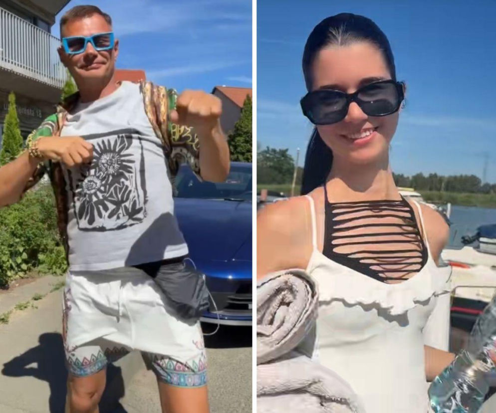 Megakot w niebieskich okularach tańczy przy aucie. Obok uśmiechnięta kobieta. O ich relacji przeczytasz na VOX FM.