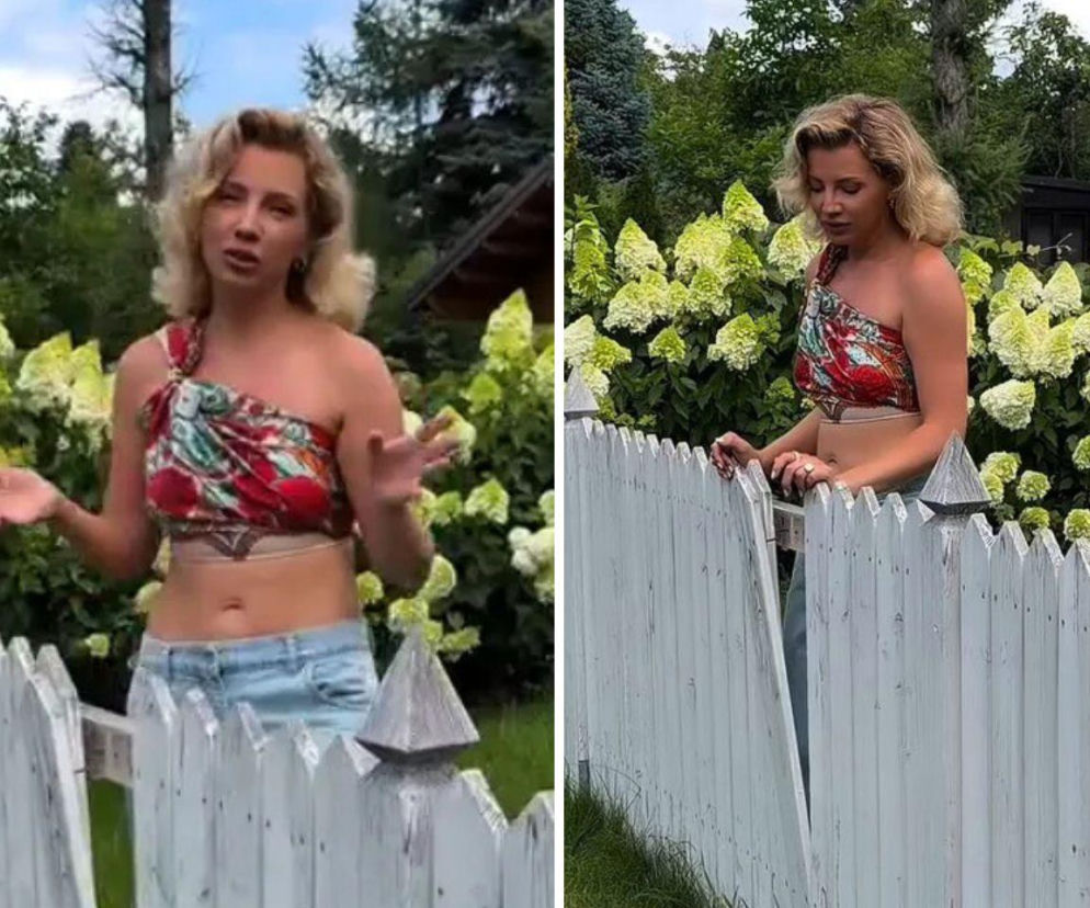 Influencerka Marta Lech-Maciejewska przy białym, drewnianym płocie. O aferze działkowej przeczytasz w serwisie Eska.
