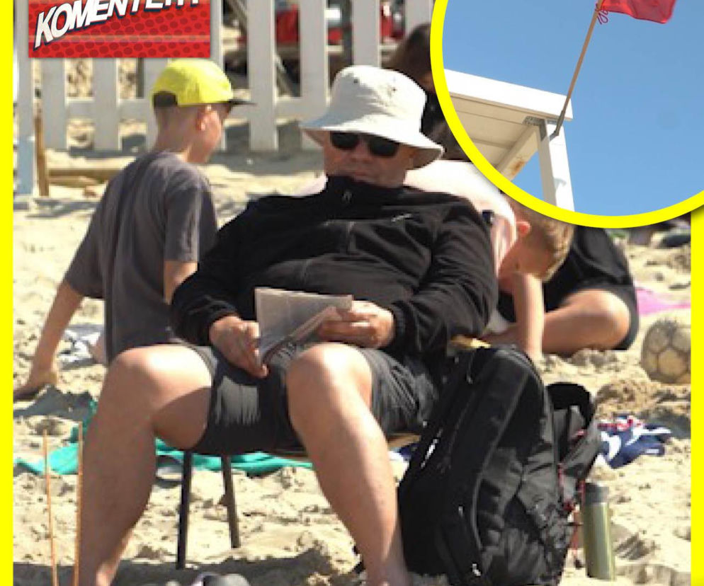 Mężczyzna w polarze na plaży. Na miniaturze obok czerwona flaga. O nastrojach nad Bałtykiem przeczytasz na SE.