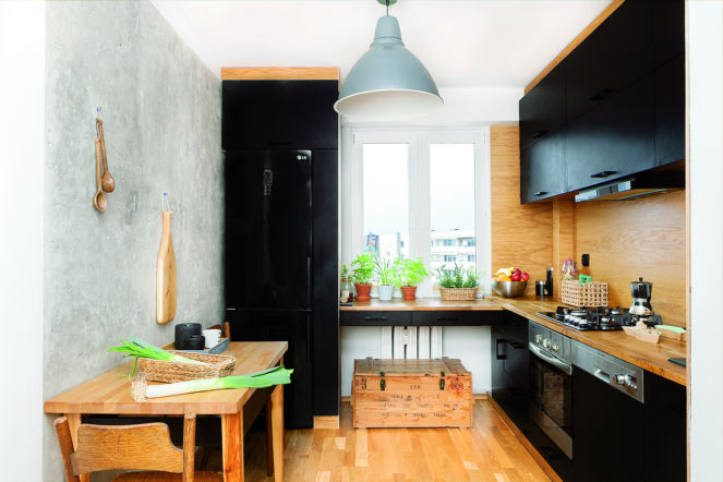 Kuchnia w męskim stylu. Czarne meble, drewno i beton