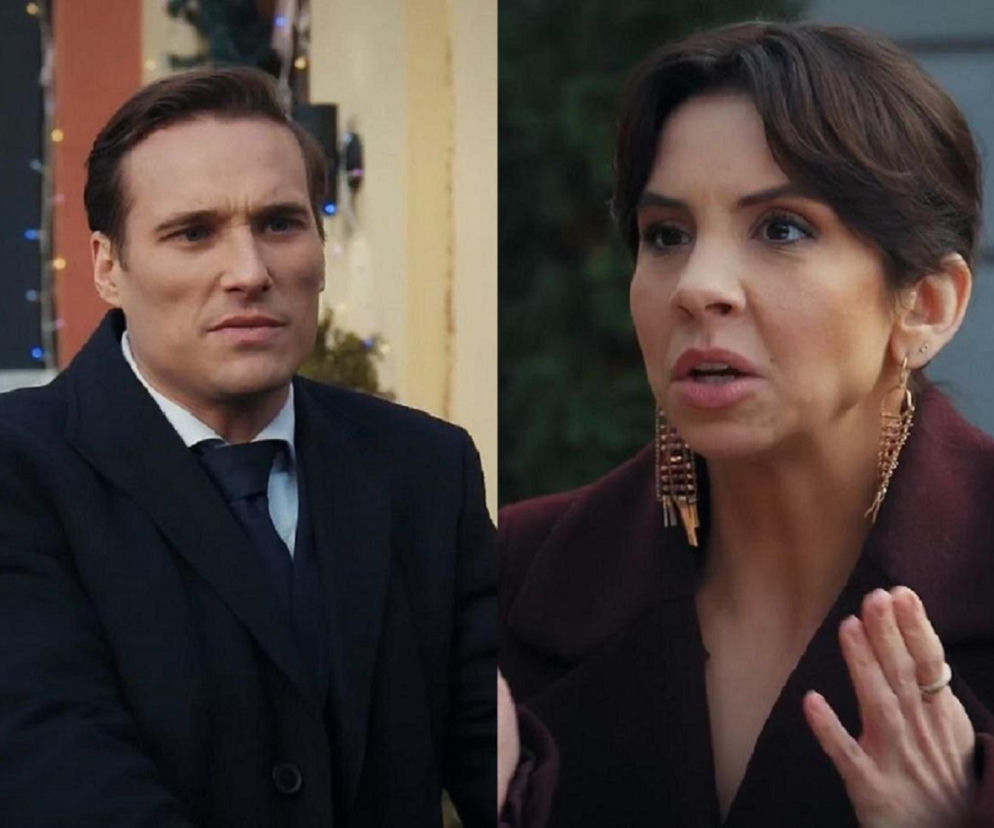 Aktorzy Ilona Janyst jako Aneta i Maurycy Popiel jako Olek z serialu M jak miłość podczas kłótni o tort weselny. Aneta gestykuluje, Olek patrzy z powagą. Więcej o ich perypetiach na Super Seriale.