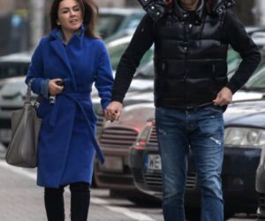 Beata Tadla z partnerem trzymają się za ręce. 