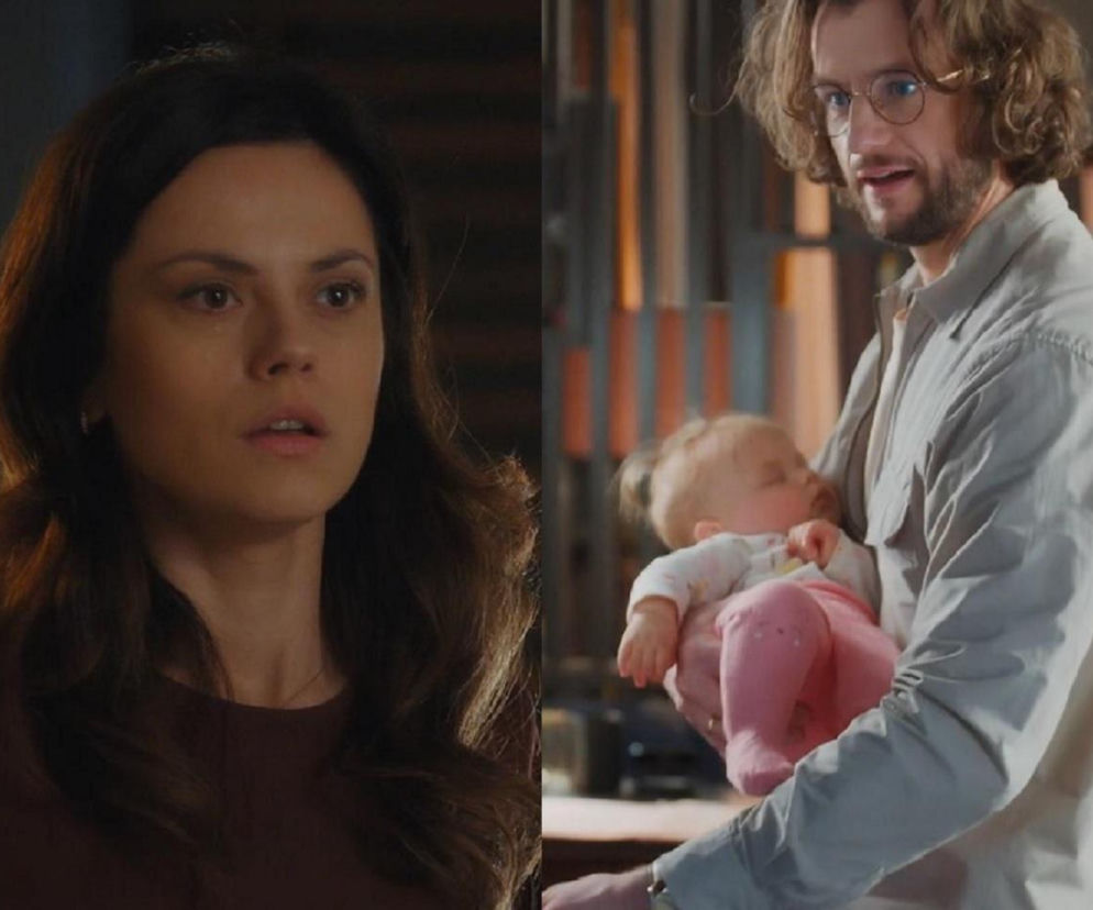 Kasia zaniepokojona w zbliżeniu na twarz, obok Mariusz, ojciec Zosi, trzymający śpiące niemowlę. Emocje i sekrety z M jak miłość w tle. Więcej o losach bohaterów na Super Seriale.