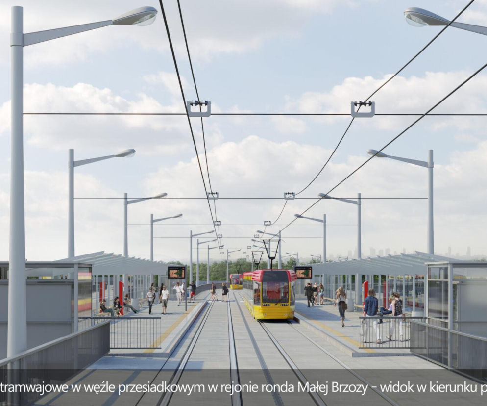 Wizualizacja nowoczesnych przystanków tramwajowych w węźle przesiadkowym na Zielonej Białołęce w Warszawie, prezentująca żółte tramwaje i infrastrukturę, gdzie na portalu Architektura Murator Plus można znaleźć więcej informacji o projektowanych trasach.