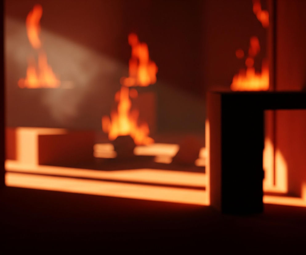 Rozmyty obraz przedstawia wnętrze pomieszczenia oświetlonego ciepłym, pomarańczowo-czerwonym światłem przypominającym ogień. W tle widoczne są nieregularne, jaskrawe plamy światła, sugerujące płomienie, odbijające się od ciemnych powierzchni. Na pierwszym planie, po prawej stronie, znajduje się duża, czarna, geometryczna forma, której krawędź jest wyraźnie zarysowana przez światło padające od lewej. Po lewej stronie widać mniejszy, ciemny prostopadłościan, a na środku sceny ciemna podstawa przechodzi w jasny, poziomy pas światła.