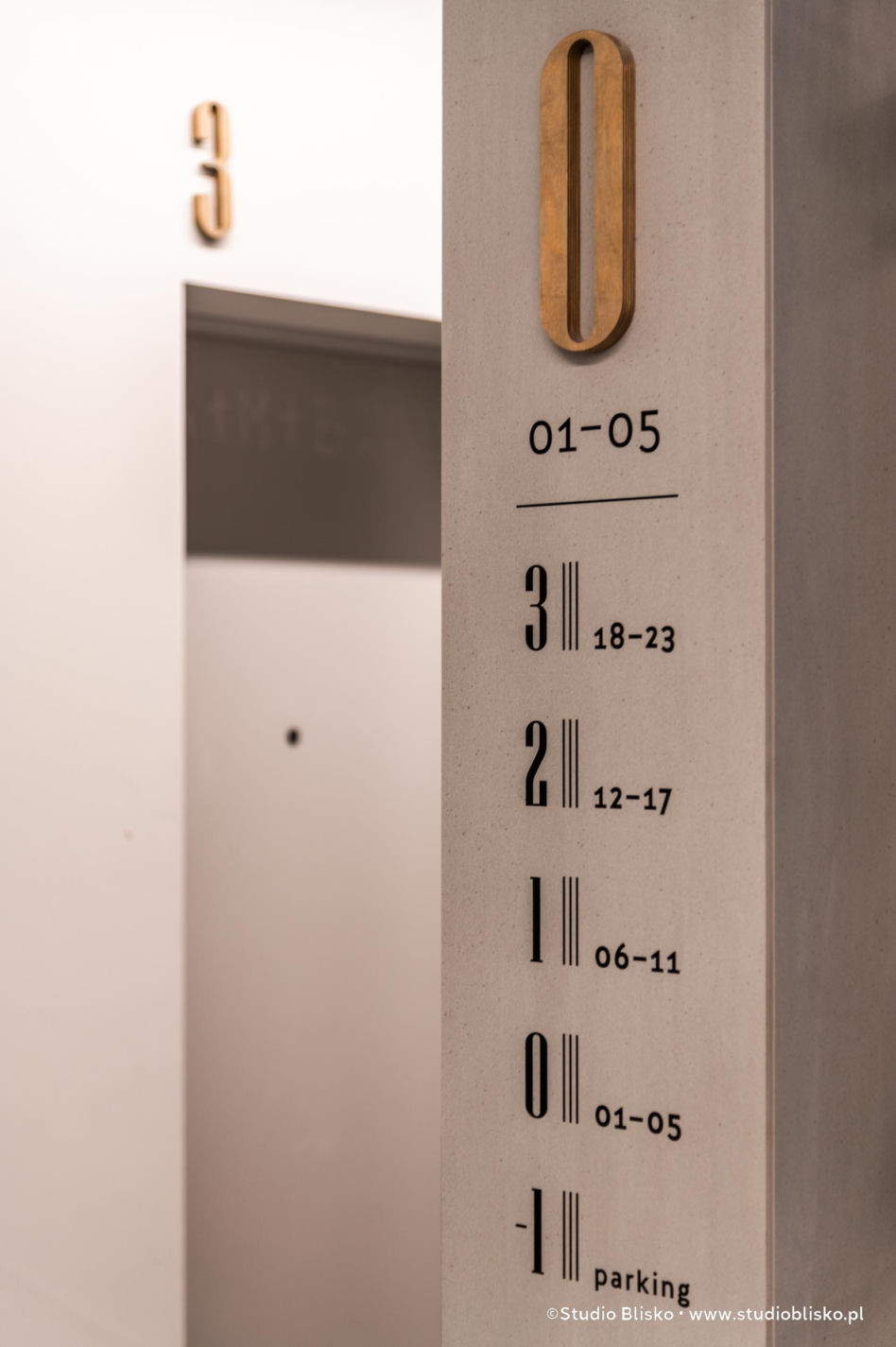 Wayfinding dla apartamentów Naturia w Toruniu 