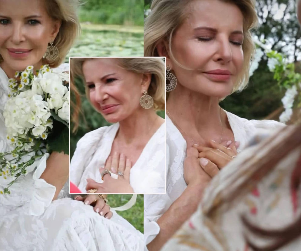 Joanna Racewicz w białej sukni z kwiatami i dłonią na sercu. O symbolicznym ślubie ze sobą przeczytasz na SE.