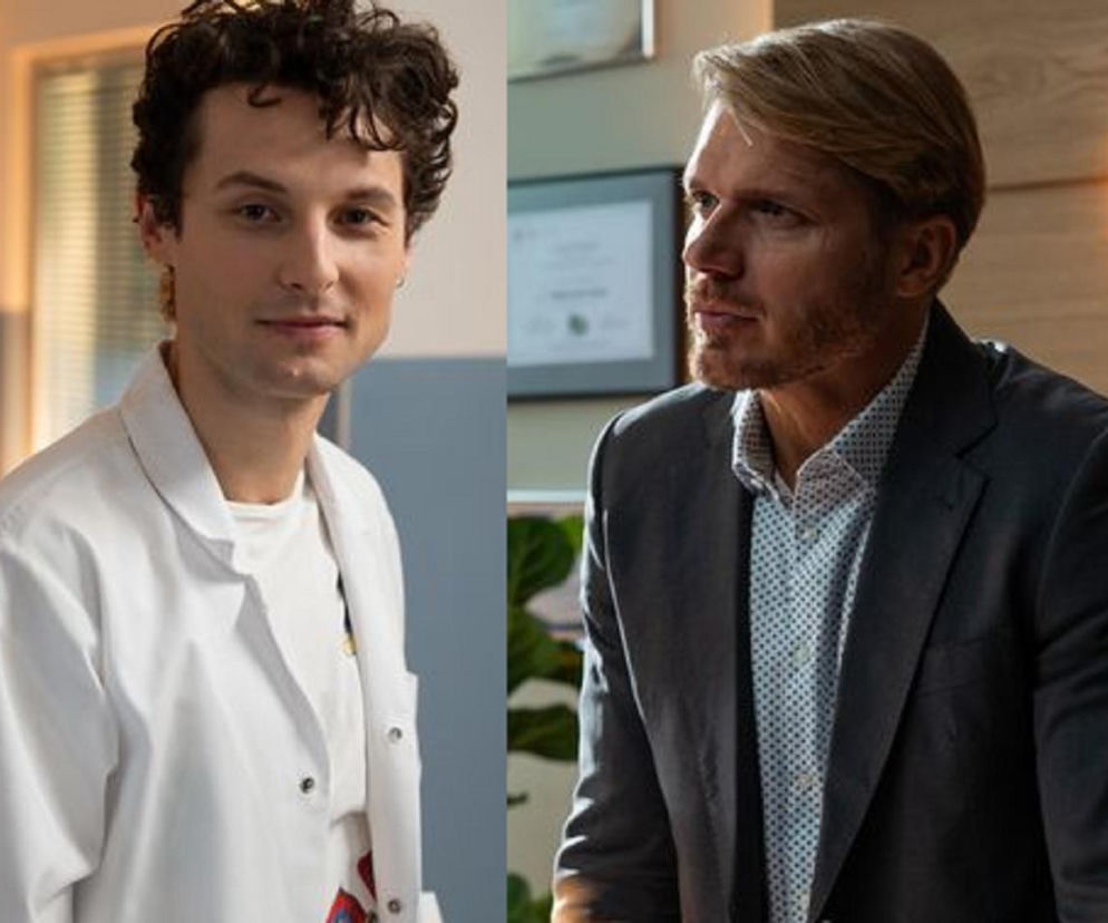 Kamil Zawada (Jakub Łopatka) w białym kitlu i Maks Beger (Tomasz Ciachorowski) w garniturze. Zdjęcie przedstawia dwóch aktorów z serialu Na dobre i na złe, którego nowe odcinki i streszczenia znajdziesz na Super Seriale.