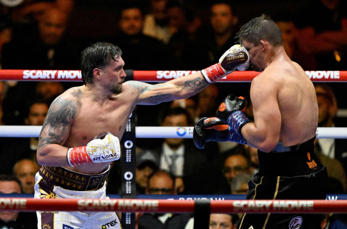 Ukraine's Oleksandr Usyk throws a flurry of punches at Netherlands' Rico Verhoeven