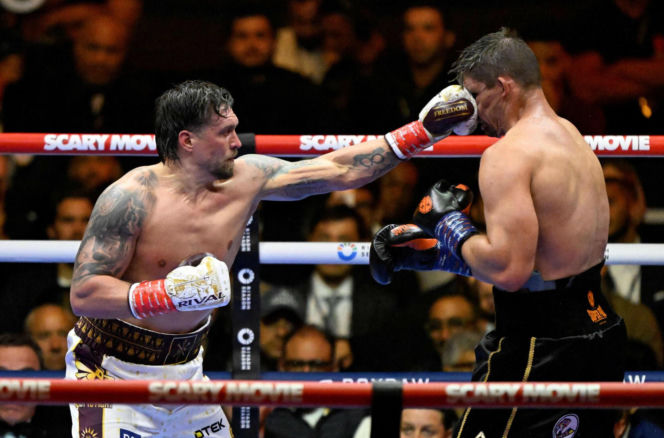 Ukraine's Oleksandr Usyk throws a flurry of punches at Netherlands' Rico Verhoeven