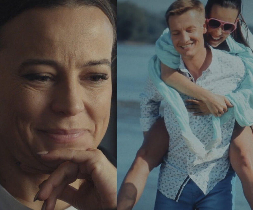 Magda (Anna Mucha) spogląda nostalgicznie na zdjęcie, na którym śmieje się, będąc na plecach Pawła (Rafał Mroczek). Fotografia odzwierciedla dawne chwile radości bohaterów M jak miłość, o których więcej przeczytasz na portalu Super Seriale.