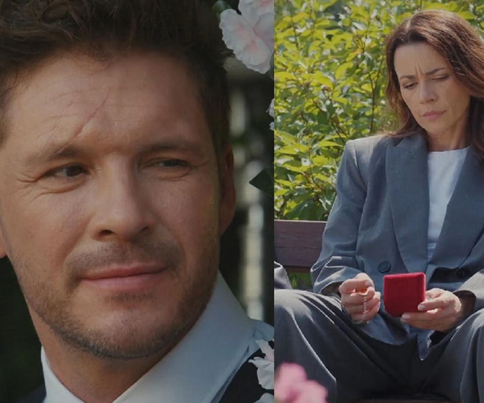 Mężczyzna w białej koszuli i kobieta w szarym garniturze, trzymająca czerwone pudełeczko z biżuterią. Ujęcia przedstawiają Mikołaja Roznerskiego jako Marcina i Magdalenę Turczeniewicz jako Martynę w scenach z serialu M jak miłość. Więcej informacji o serialach znajdziesz na Super Seriale.