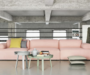 Różowa sofa w industrialnym skandynawskim wnętrzu.