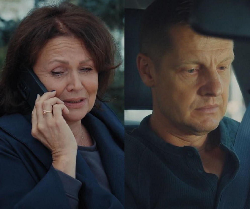 Małgorzata Pieńkowska jako Marysia Rogowska rozmawiająca przez telefon i Rafał Mroczek jako Paweł Zduński siedzący w samochodzie. Smutna Marysia, ubrana w granatowy płaszcz i szarą bluzkę, trzyma czarny telefon przy uchu. Ma na palcu pierścionek z różowym oczkiem. Paweł, również zasmucony, ma na sobie granatową koszulkę i zapięty pas bezpieczeństwa. Dowiedz się więcej o Super Seriale.