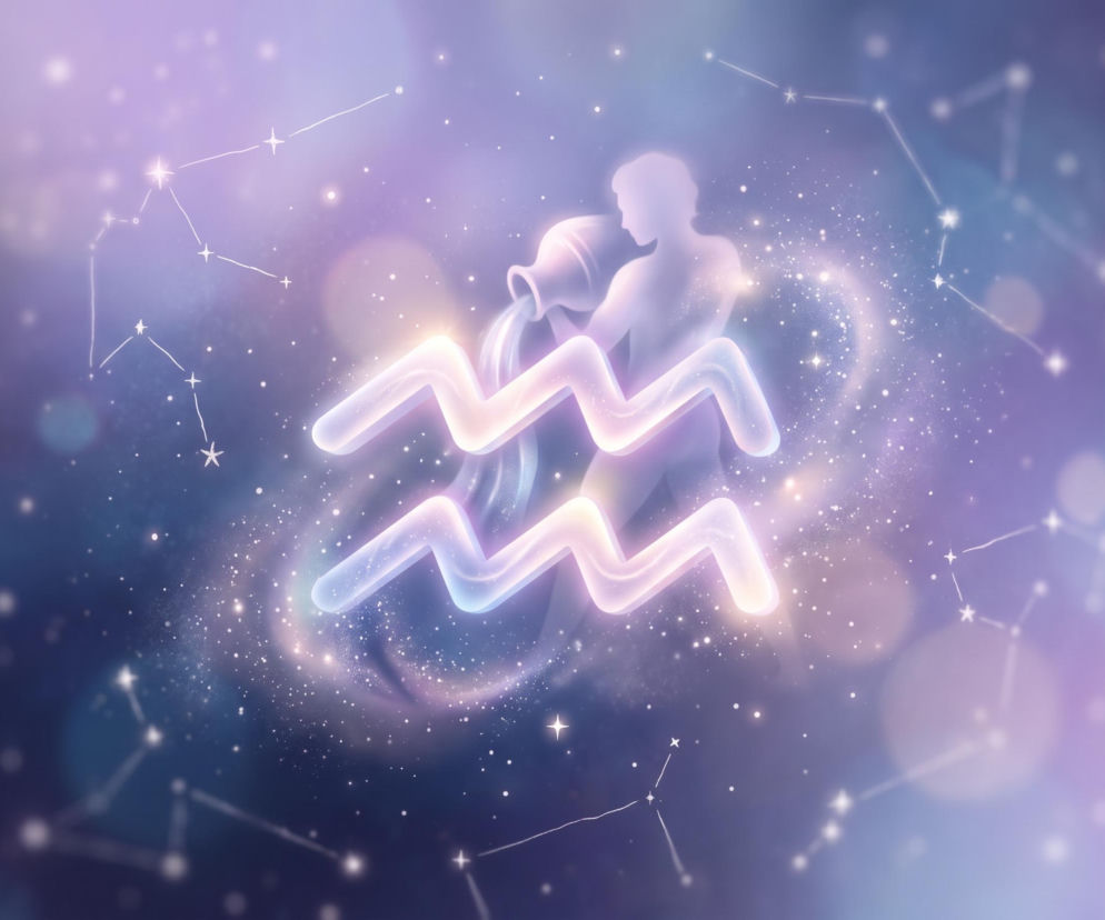 Świecący symbol Wodnika na tle kosmosu. O horoskopie dla tego znaku przeczytasz na Eska.