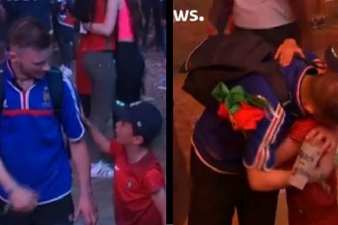 Piękny obrazek z ulic Paryża. Młody kibic Portugalii pociesza płaczącego Francuza
