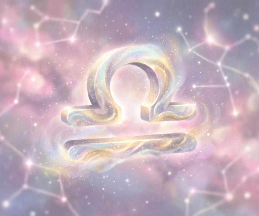 Symbol znaku zodiaku Wagi w odcieniach różu, fioletu i złota, unoszący się w kosmosie, otoczony błyszczącymi gwiazdami i zarysem konstelacji. Horoskop dzienny dla Wagi na 26 czerwca znajdziesz na naszym portalu.