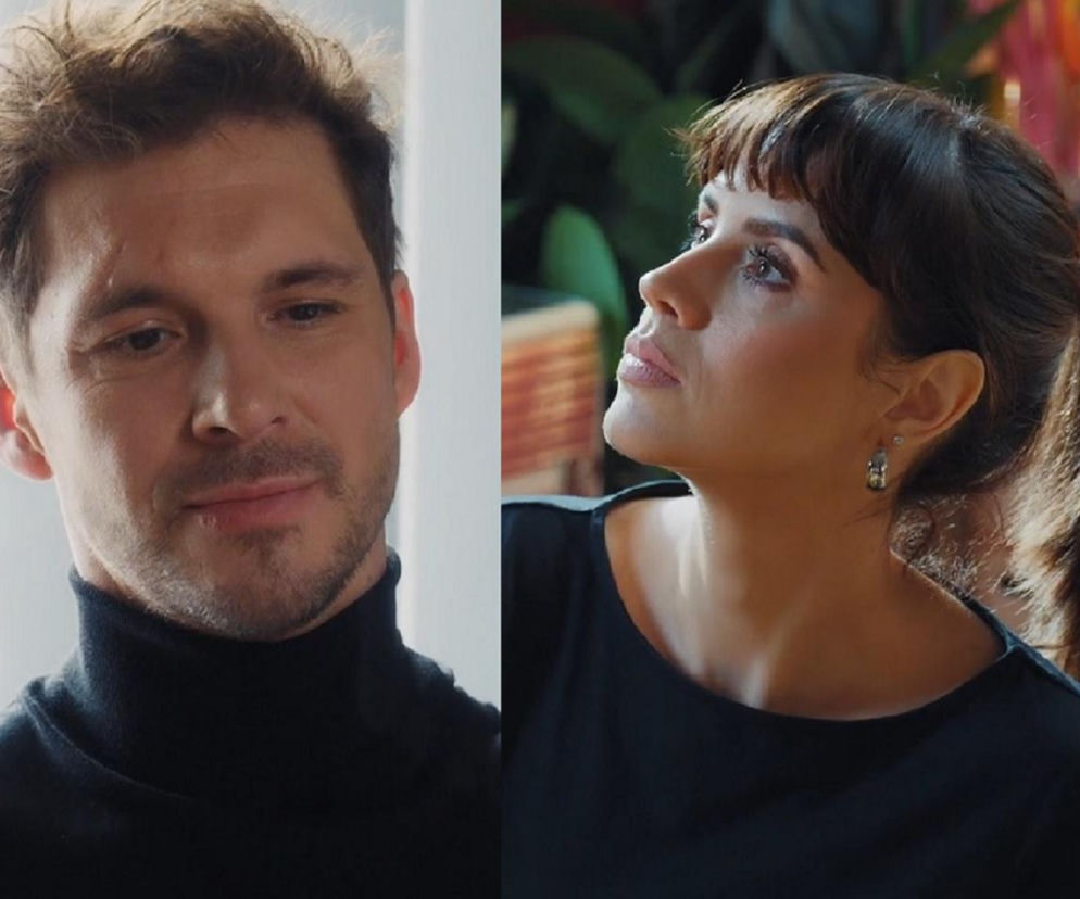 Mikołaj Roznerski jako Marcin Chodakowski w czarnym golfie z brodą i Katarzyna Dąbrowska jako Elżbieta Domańska z grzywką i spiętymi włosami w ciemnej bluzce z kolczykami, na portalu Super Seriale dowiesz się o ich relacjach w M jak miłość.