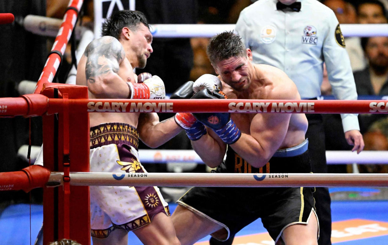 Ukraine's Oleksandr Usyk throws a flurry of punches at Netherlands' Rico Verhoeven