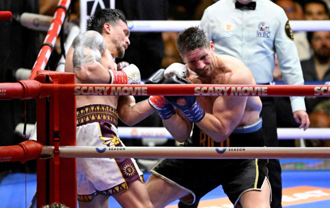 Ukraine's Oleksandr Usyk throws a flurry of punches at Netherlands' Rico Verhoeven