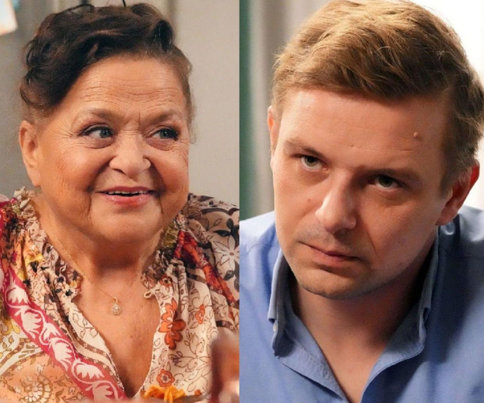 Grażyna Zielińska jako Lucyna Zwierzchowska uśmiecha się, patrząc w prawo, w kwiecistej bluzce z naszyjnikiem, obok Marek Molak jako Hubert Pyrka w błękitnej koszuli, z poważnym wyrazem twarzy, patrzący wprost. Scena z serialu Barwy szczęścia dostępna na Super Seriale.