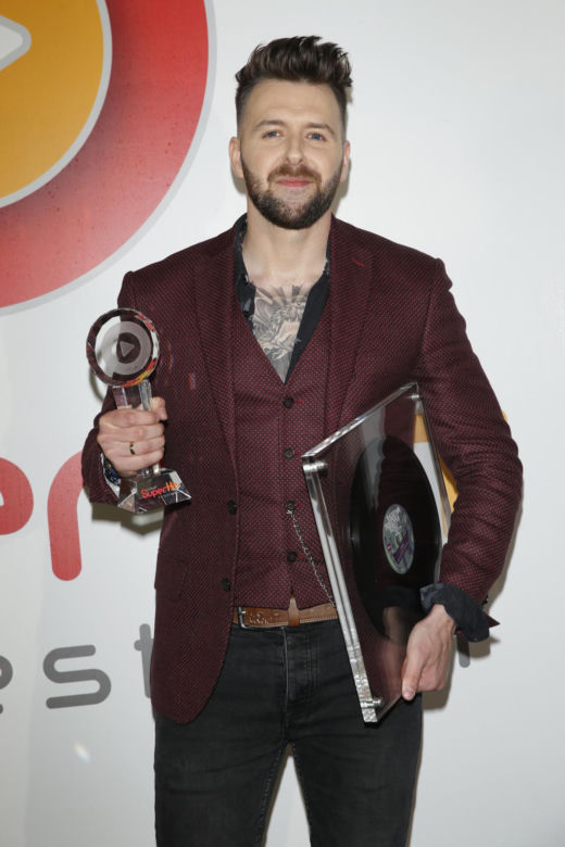 Grzegorz Hyży kiedyś i dziś. Od skromnego chłopaka z "X Factora" do ikony męskiego stylu