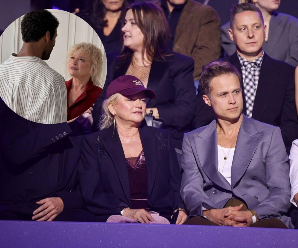 Katarzyna Figura w bordowej czapce i granatowej marynarce siedzi obok eleganckiego mężczyzny w szarym garniturze; w tle inni widzowie. W okręgu kolażu widać aktorkę i Gamou Falla, patrzących na siebie. O ich wspólnym projekcie artystycznym przeczytasz na naszym portalu.